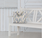 Weekender Tote with Dancing Delphinium on Cream pattern on a bench