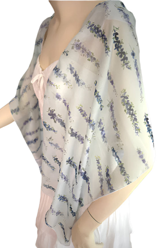 Mannequin wearing a floral shawl or scarf 