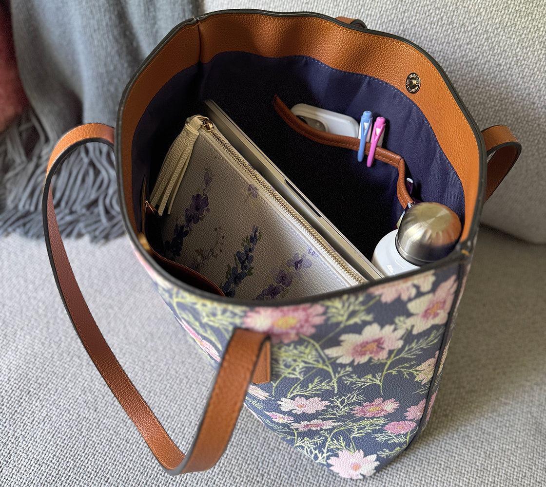 Vegan Leather clutch or makeup bag in Delphinium shown inside our carryall in Airy Cosmos.